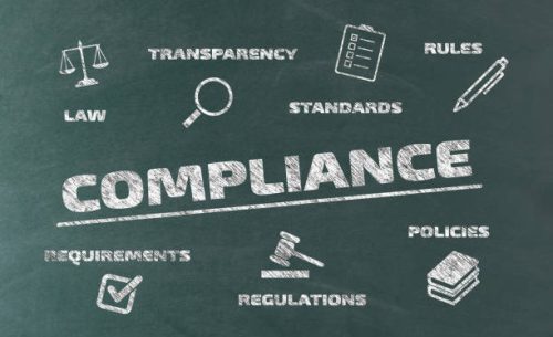 compliance concept on blackboard